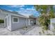 Charming home featuring a well-manicured walkway and a beautifully landscaped yard at 8635 Boca Ciega Dr, St Pete Beach, FL 33706