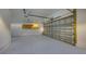 Spacious and clean garage interior featuring ample storage space and a modern design at 8635 Boca Ciega Dr, St Pete Beach, FL 33706