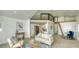 Open-concept living space featuring modern decor and a cozy loft area above at 8635 Boca Ciega Dr, St Pete Beach, FL 33706