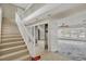 View of entryway featuring staircase, tile flooring, mirrored closet and view of living area at 892 Harbor Is, Clearwater Beach, FL 33767