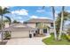 Charming two-story home with a beautifully landscaped yard and brick driveway at 892 Harbor Is, Clearwater Beach, FL 33767