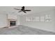 Living room with fireplace and large windows with plantation shutters overlooking the property at 892 Harbor Is, Clearwater Beach, FL 33767