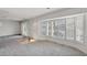 Spacious living room area with large bay windows and plantation shutters overlooking the canal at 892 Harbor Is, Clearwater Beach, FL 33767