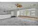 Spacious living room area with arched openings and plantation shutters that have a view of the canal at 892 Harbor Is, Clearwater Beach, FL 33767