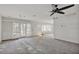 Bright living room featuring large windows and sliding doors at 892 Harbor Is, Clearwater Beach, FL 33767