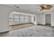 Living room area with arched openings and plantation shutters that have a view of the canal at 892 Harbor Is, Clearwater Beach, FL 33767