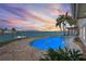 Beautiful pool area with views of the inter coastal waterway and a colorful sunset at 892 Harbor Is, Clearwater Beach, FL 33767