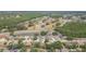 An aerial view of a neighborhood near a highway, a wooded area, and golf course at 9112 Calle Alta, New Port Richey, FL 34655