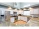 Bright kitchen with stainless steel appliances, granite countertops, and recessed lighting at 9112 Calle Alta, New Port Richey, FL 34655