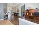 Bright living room features high ceilings, wood floors, and access to the outdoor patio at 9112 Calle Alta, New Port Richey, FL 34655
