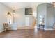 Bright living room with wood floors, neutral walls, and a welcoming ambiance at 9112 Calle Alta, New Port Richey, FL 34655