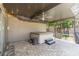 Covered patio with a hot tub, ceiling fan, string lights, and tiled floors for relaxation and outdoor enjoyment at 9112 Calle Alta, New Port Richey, FL 34655