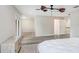 Bright primary bedroom features neutral walls, wood floors and a ceiling fan at 923 Lumsden Reserve Dr, Brandon, FL 33511