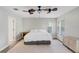 Cozy bedroom features wood floors, neutral walls, ceiling fan and a window with blinds at 923 Lumsden Reserve Dr, Brandon, FL 33511