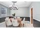 Elegant dining room with chandelier and wainscoting at 923 Lumsden Reserve Dr, Brandon, FL 33511