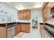 Bright and efficient kitchen with granite countertops and ample cabinet space at 923 Lumsden Reserve Dr, Brandon, FL 33511