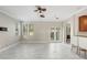 Open-concept living area with ceiling fans and access to the backyard at 923 Lumsden Reserve Dr, Brandon, FL 33511