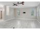 Spacious living room with white-tiled floors and natural light at 923 Lumsden Reserve Dr, Brandon, FL 33511