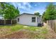 White home featuring a fenced backyard and steps leading up to a small porch at 9403 N 13Th St, Tampa, FL 33612