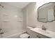 Clean bathroom featuring a shower-tub combination and a classic vanity with an ornate mirror at 9403 N 13Th St, Tampa, FL 33612