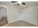 Bedroom with carpet, ceiling fan, and closet at 9403 N 13Th St, Tampa, FL 33612