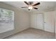 Nice bedroom with carpet, closet, and a bright window at 9403 N 13Th St, Tampa, FL 33612