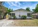 Charming single-story home with a freshly painted exterior and manicured landscaping at 9403 N 13Th St, Tampa, FL 33612