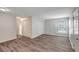 Living room featuring new wood flooring, neutral paint and large windows with natural light at 9403 N 13Th St, Tampa, FL 33612