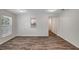 Open-concept living room features hardwood floors, a pass-through to the kitchen, and neutral paint at 9403 N 13Th St, Tampa, FL 33612