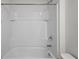 All-white bathtub and shower combination, complete with tile surround and chrome fixtures at 10940 Trailing Vine Dr, Tampa, FL 33610