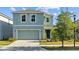 Beautiful two-story home with a well-maintained lawn and inviting curb appeal at 10940 Trailing Vine Dr, Tampa, FL 33610