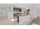 Spacious kitchen with modern appliances, a center island, and ample cabinet space at 10940 Trailing Vine Dr, Tampa, FL 33610