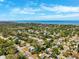 Beautiful aerial view of a coastal neighborhood with lush greenery and waterfront scenery at 1118 Captains Way, Tarpon Springs, FL 34689