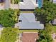 Aerial view of the house showing roof and yard at 1118 Captains Way, Tarpon Springs, FL 34689