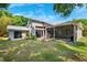 Exterior backyard featuring the patio area with a large grassy area at 1118 Captains Way, Tarpon Springs, FL 34689