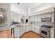 Bright kitchen featuring stainless steel appliances, sleek countertops, and an open design at 1118 Captains Way, Tarpon Springs, FL 34689