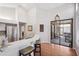 Modern kitchen with breakfast bar, stainless steel refrigerator, and sliding glass doors to the patio at 1118 Captains Way, Tarpon Springs, FL 34689
