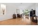 Light-filled living area boasting bamboo floors, a decorative barrel, and sliding glass doors to the outside at 1118 Captains Way, Tarpon Springs, FL 34689