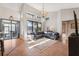 Open living room with high ceilings, statement lighting, and glass patio doors at 1118 Captains Way, Tarpon Springs, FL 34689