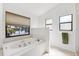 Bright bathroom features a soaking tub with tiled surround, adjacent to an enclosed shower at 1118 Captains Way, Tarpon Springs, FL 34689