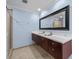 This primary bathroom features dual sinks, a large mirror, and a tiled shower stall at 1120 E Kennedy Blvd # 1228, Tampa, FL 33602