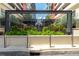 Elegant entrance to the Grand Central building with greenery and a decorative logo at 1120 E Kennedy Blvd # 1228, Tampa, FL 33602