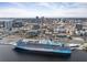 A cruise ship docked in the harbor with the city skyline in the background at 1120 E Kennedy Blvd # 1228, Tampa, FL 33602