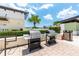 This outdoor grilling area features two stainless steel grills, a trash can, and partial shade from the Florida sun at 1120 E Kennedy Blvd # 1228, Tampa, FL 33602