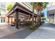 Spacious outdoor dining area with covered seating, tables, and views of the street at 1120 E Kennedy Blvd # 1228, Tampa, FL 33602