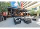 Inviting outdoor seating area with modern furniture and a cozy fire pit at 1120 E Kennedy Blvd # 1228, Tampa, FL 33602
