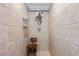 This newly renovated shower stall features neutral tiling, a shower seat, and a modern showerhead at 1120 E Kennedy Blvd # 1228, Tampa, FL 33602