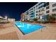 This luxurious swimming pool is surrounded by loungers and has a beautiful view of the building's architectural design at 1120 E Kennedy Blvd # 1228, Tampa, FL 33602