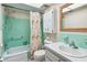 Bathroom featuring shower-tub combo, floral shower curtain, vanity and built in cabinet at 11200 102Nd Ave # 48, Seminole, FL 33778