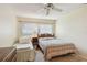 Cozy bedroom with two twin beds, a window, and neutral decor at 11200 102Nd Ave # 48, Seminole, FL 33778